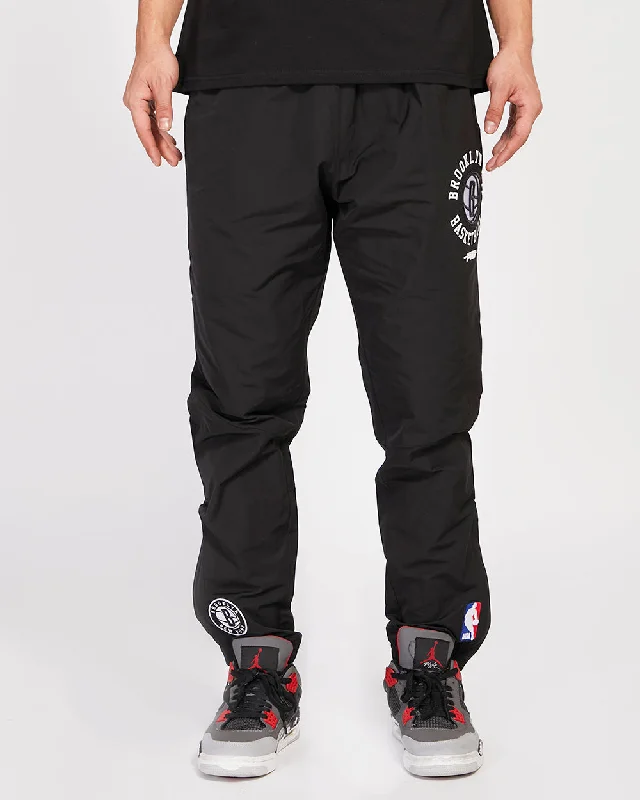 NBA BROOKLYN NETS HYBRID MEN'S WOVEN PANT (BLACK) Cozy Fitted Pants